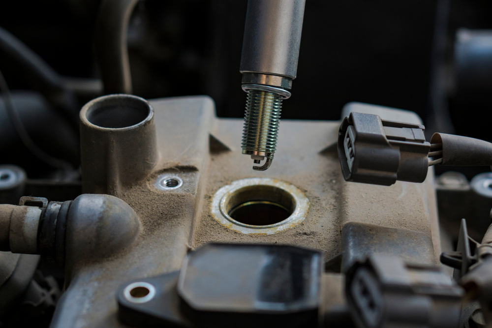 Car,Engine,Repair.,Replacing,The,Spark,Plugs,In,The,Engine.